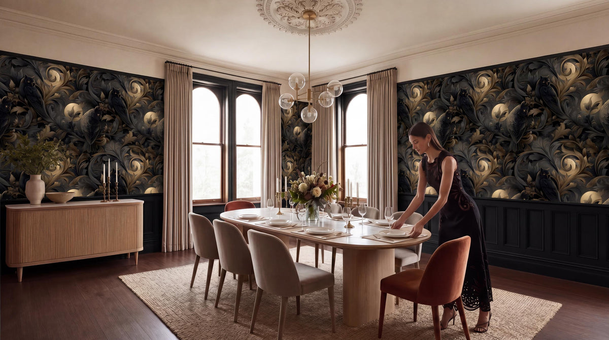 A woman in a black dress is setting the table in a dining room with a large, ornate chandelier overhead, a wooden table with white plates and silverware, and a black and gold patterned wallpaper.