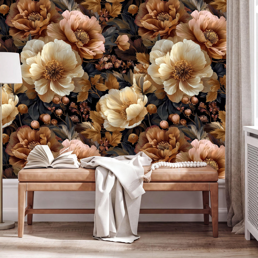 a large floral wallpaper with a warm, earthy color palette of browns, oranges, and yellows. The wallpaper covers the entire wall behind a wooden bench, creating a cozy and inviting atmosphere. On the bench, there is an open book and a white blanket, suggesting a comfortable and relaxing setting.