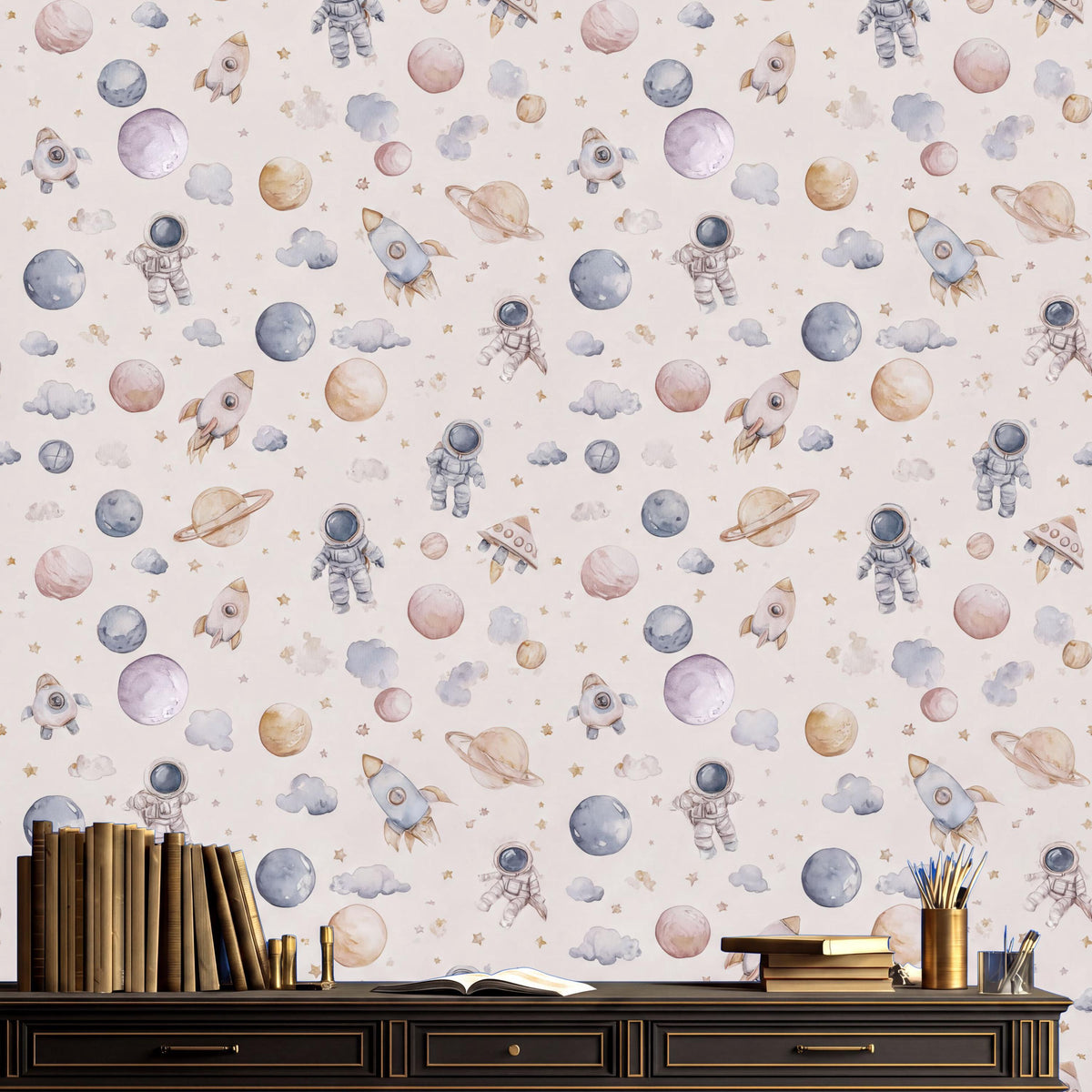 a wallpapered wall with various space-themed illustrations, including planets, rockets, and astronauts. There is a wooden shelf or cabinet in the foreground with several books and a cup.