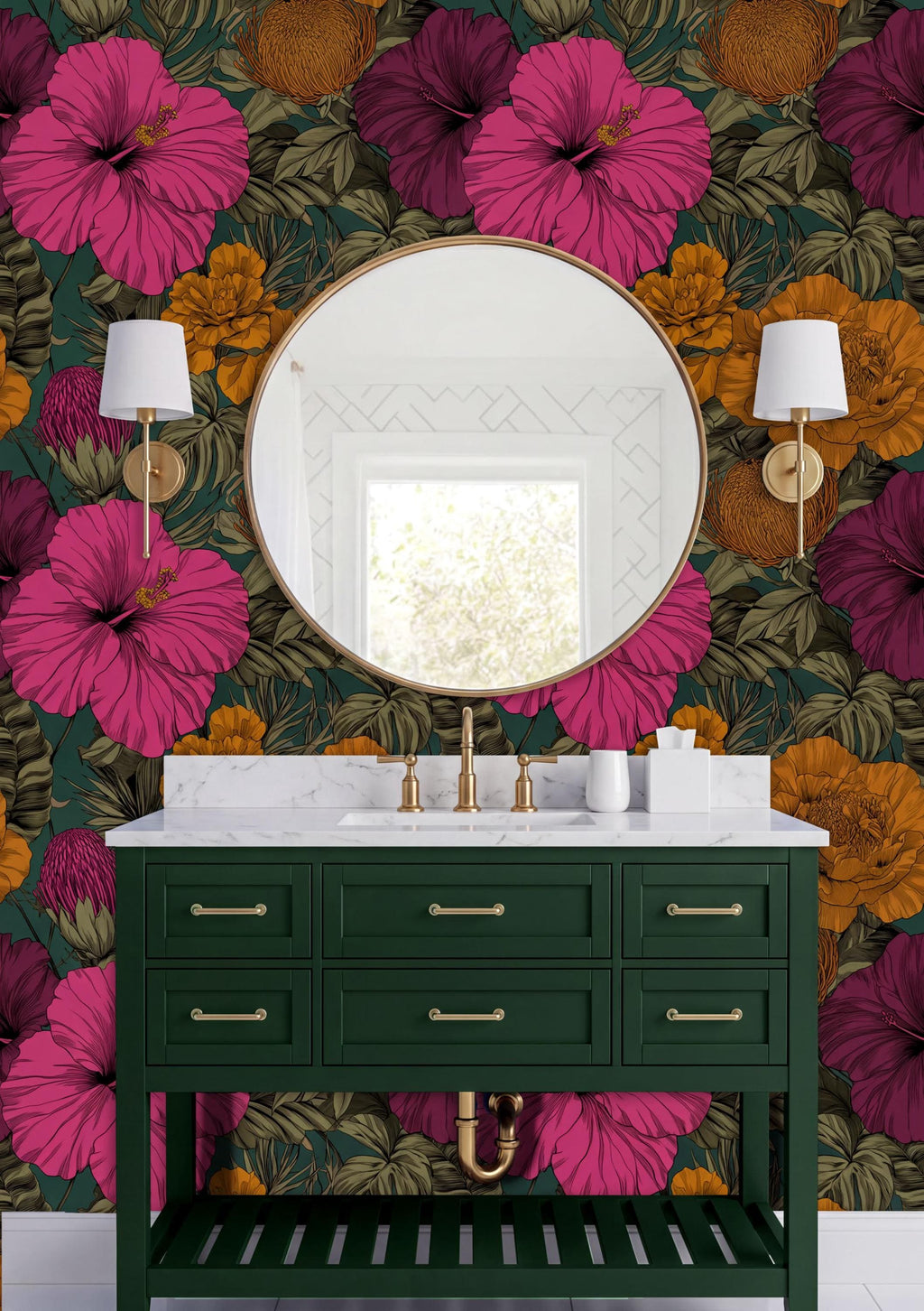a bathroom with a green vanity and a round mirror above it. The wall behind the vanity is covered in a vibrant floral wallpaper in shades of pink, orange, and green. There are two white lamps on either side of the mirror, and the overall color scheme of the bathroom is predominantly green and pink.