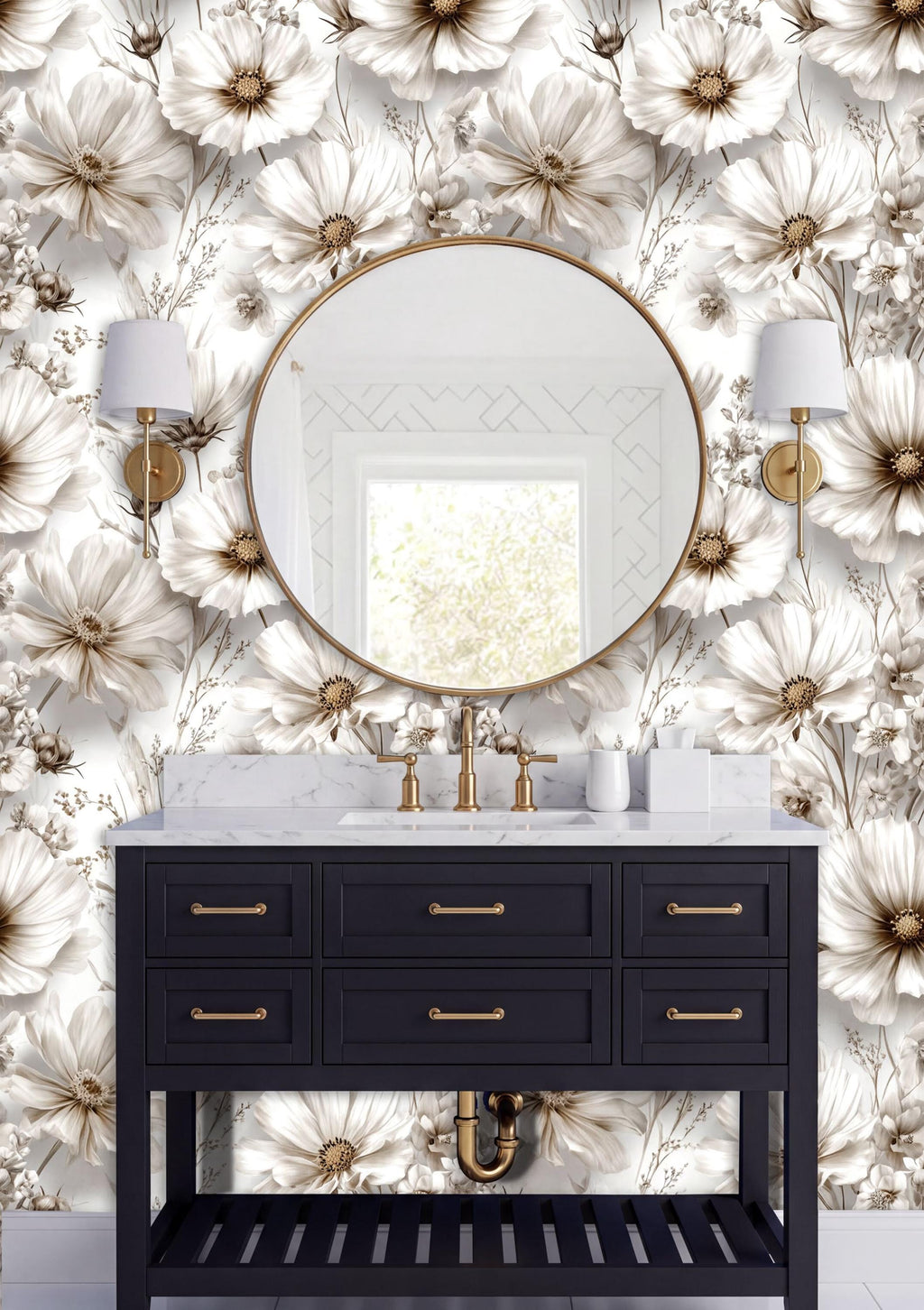 a bathroom vanity with a black cabinet and a round mirror above it. The vanity has gold handles and is set against a wall with a floral wallpaper. There are two white lamps on either side of the mirror, and the overall color scheme is predominantly white and gold.