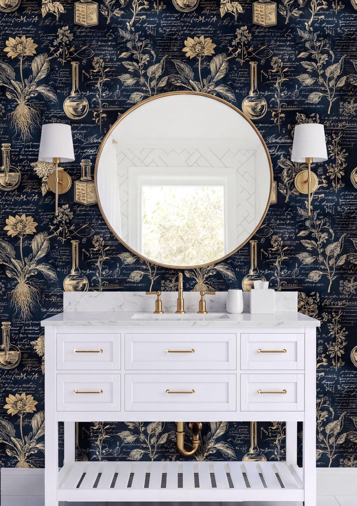 a bathroom vanity with a white countertop, a round mirror, and two white lamps on either side of the vanity. The wall behind the vanity has a dark blue and gold floral wallpaper.