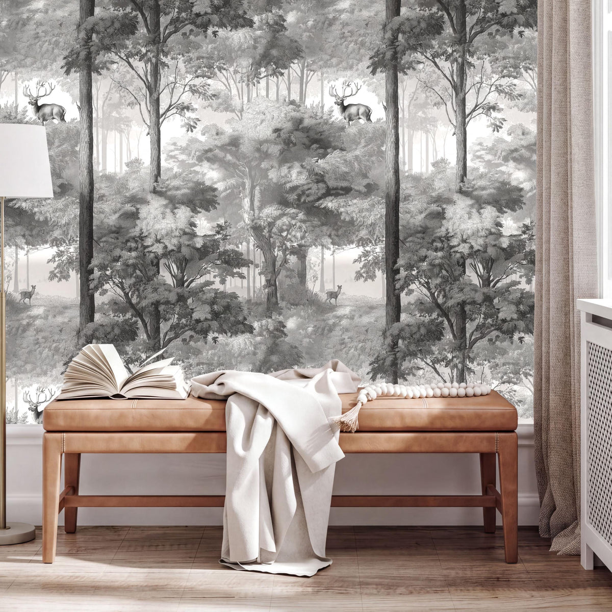 a wooden bench with an open book on it, situated in front of a large wall mural depicting a forest scene with deer.