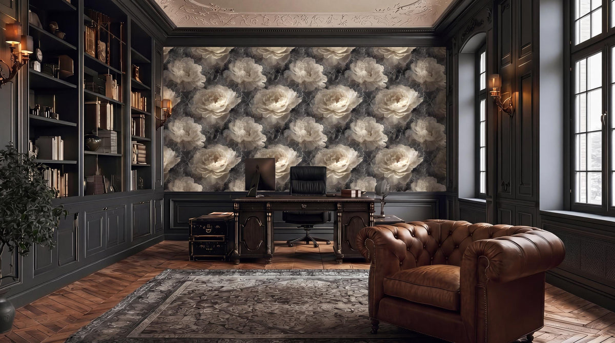 a luxurious and elegant living room with a large floral wallpaper covering the wall behind a desk and a comfortable leather armchair.