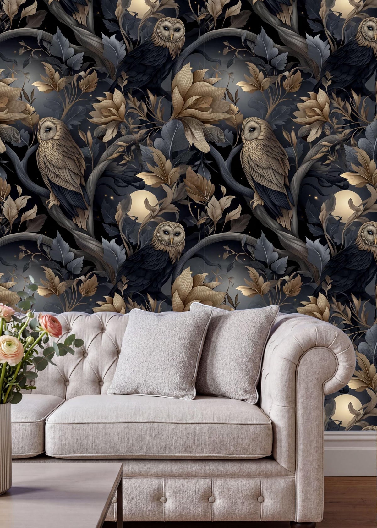 a living room with a white tufted sofa and a vase of flowers on a coffee table. The sofa is positioned against a wall with a dark, ornate wallpaper that includes a pattern of owls and flowers in shades of gold and black.