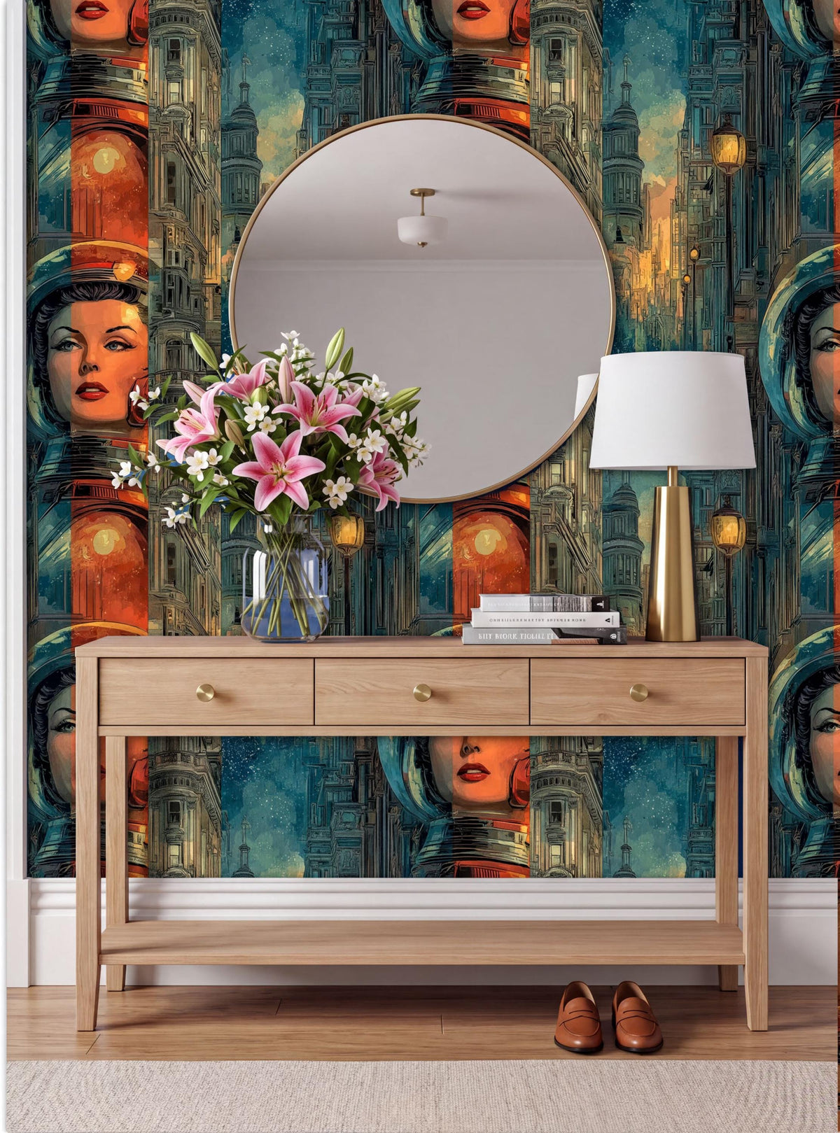 a wooden console table with a round mirror above it, a vase of flowers, and a lamp on the table. The wall behind the table has a vibrant, colorful wallpaper with a repeating pattern of faces and buildings.
