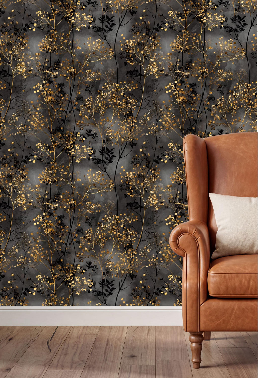 a dark gray wall with a gold leaf pattern, and a brown leather armchair with a white pillow placed against it.
