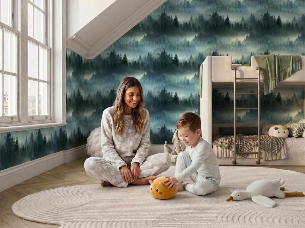 A woman and a young boy are sitting on the floor in a cozy bedroom, surrounded by stuffed animals and a large mural depicting a forest scene.