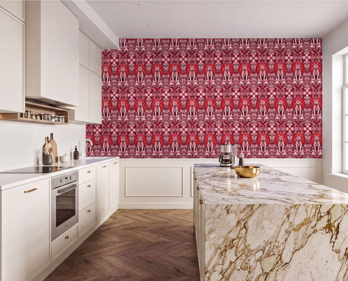 a modern kitchen with a large, marble-topped island and white cabinets. The kitchen features a red and white patterned wallpaper on the walls, and the floor is made of wood. The countertops are made of marble, and there are various kitchen appliances and utensils visible in the space.